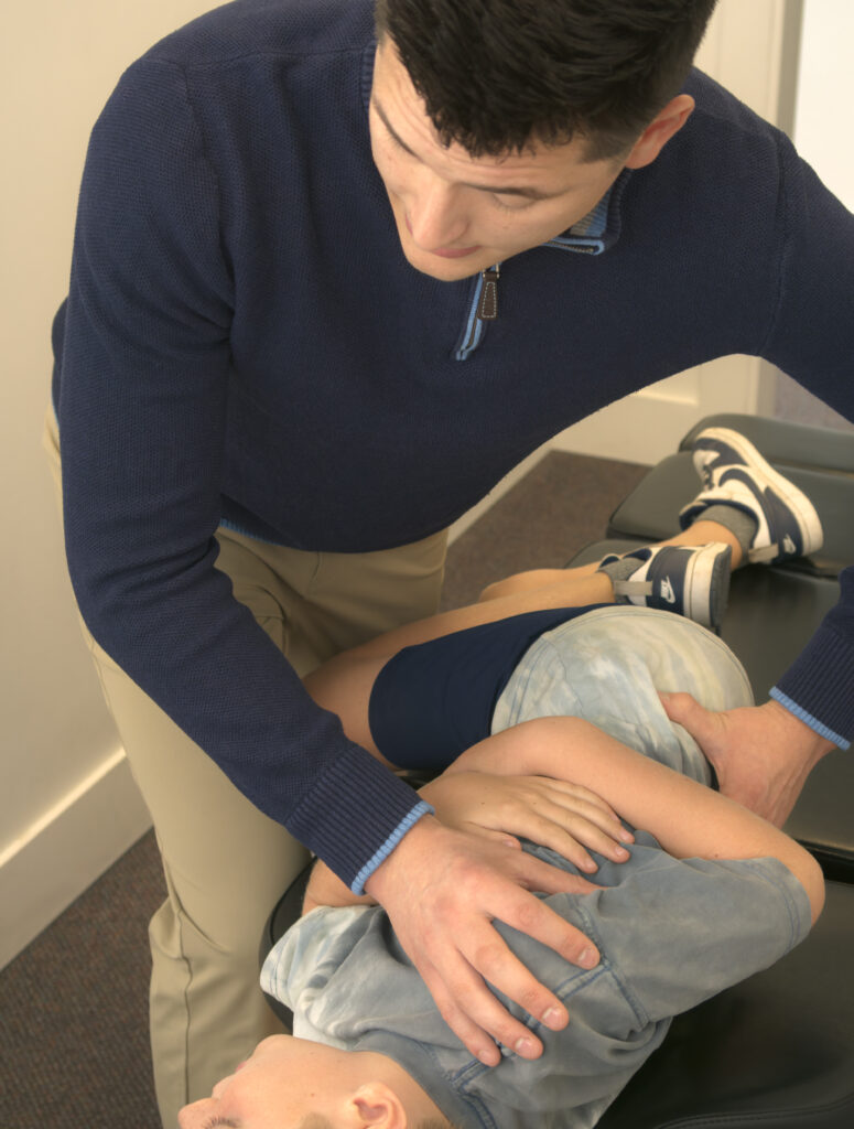 Dr. Matthew Wittwer giving hid patient hip pain treatment