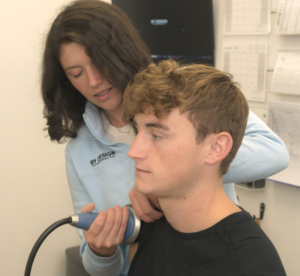 patient having a shockwave treatment for shoulder pain